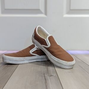 Vans cow print slip ons